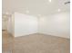 Spacious living room with neutral tile flooring and recessed lighting at 335 S San Gregorio Ln, Casa Grande, AZ 85194
