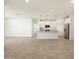 Spacious living area and adjacent kitchen with stainless steel appliances at 335 S San Gregorio Ln, Casa Grande, AZ 85194
