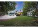 Scenic backyard showcasing a swimming pool, patio, and lush landscaping at 3417 E Mission E Ln, Phoenix, AZ 85028