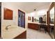 This primary bathroom has a separate vanitiy area, dual sinks and a glass enclosed shower at 3417 E Mission E Ln, Phoenix, AZ 85028