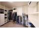 Organized walk-in closet with ample shelving and hanging space for clothes and accessories at 3417 E Mission E Ln, Phoenix, AZ 85028