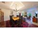 Inviting dining room with a traditional chandelier and views of the living area at 3417 E Mission E Ln, Phoenix, AZ 85028