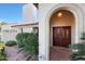 Elegant front entrance with beautiful double doors, tiled walkway, and manicured landscaping at 3417 E Mission E Ln, Phoenix, AZ 85028