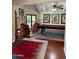 This room has a pool table, wood floors, a fireplace, and large windows that let in natural light at 3417 E Mission E Ln, Phoenix, AZ 85028