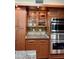 This kitchen has stainless steel appliances, granite countertops, and wood cabinets and is beautifully lit at 3417 E Mission E Ln, Phoenix, AZ 85028
