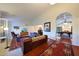 Spacious living room with hardwood floors, plush seating, and an archway leading to game room at 3417 E Mission E Ln, Phoenix, AZ 85028