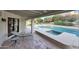 Inviting outdoor pool area with a spa, surrounded by well-maintained landscaping and a covered patio for relaxation at 3417 E Mission E Ln, Phoenix, AZ 85028