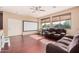 Finished bonus room with theater screen, comfortable seating, and plenty of natural light at 3680 S Tower Ave, Chandler, AZ 85286