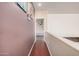Upstairs hallway with hardwood floors and neutral walls leading to bedrooms or other living spaces at 3680 S Tower Ave, Chandler, AZ 85286