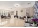 Open-concept living room and dining area with tile floors and neutral color scheme at 3680 S Tower Ave, Chandler, AZ 85286
