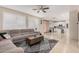 Open-concept living room with modern decor, tile floors, and a view into the well-equipped kitchen at 3680 S Tower Ave, Chandler, AZ 85286