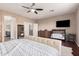 Comfortable main bedroom with a king-size bed, hardwood floors, ensuite bathroom, and walk-in closet at 3680 S Tower Ave, Chandler, AZ 85286