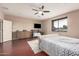 Comfortable main bedroom with a king-size bed, hardwood floors, ensuite bathroom, and walk-in closet at 3680 S Tower Ave, Chandler, AZ 85286