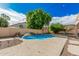 Inviting backyard pool surrounded by desert landscaping, patio, and blue skies providing a relaxing retreat at 3680 S Tower Ave, Chandler, AZ 85286