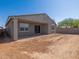 The backyard offers a covered patio and potential for landscaping at 37357 W San Sisto Ave, Maricopa, AZ 85138
