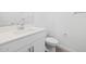 Bright bathroom featuring a white vanity, mirror, and toilet at 37357 W San Sisto Ave, Maricopa, AZ 85138
