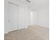 Bedroom with neutral carpet, closet with paneled doors, and white walls creating a spacious feel at 37357 W San Sisto Ave, Maricopa, AZ 85138