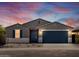 Charming single-story home with a well-manicured front yard and a two-car garage at 37357 W San Sisto Ave, Maricopa, AZ 85138