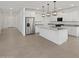 A modern kitchen with stainless steel appliances, granite countertops, and a large center island at 37357 W San Sisto Ave, Maricopa, AZ 85138