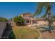 Spacious backyard with lush green grass, mature trees, and a sparkling pool, creating a serene outdoor retreat at 3765 E Oxford Ln, Gilbert, AZ 85295