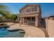 The backyard boasts a private pool with a rock waterfall feature and mature landscaping at 3765 E Oxford Ln, Gilbert, AZ 85295