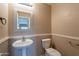 Half bathroom showing a white pedestal sink and toilet at 3765 E Oxford Ln, Gilbert, AZ 85295