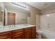 Bathroom showcasing a double sink vanity and shower-tub combo at 3765 E Oxford Ln, Gilbert, AZ 85295