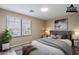 Virtually Staged bedroom showing a large window, a bed, and two nightstands at 3765 E Oxford Ln, Gilbert, AZ 85295