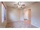Compact bedroom with a ceiling fan, tile floors, and natural light at 3765 E Oxford Ln, Gilbert, AZ 85295