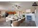 Virtually staged dining room with marble table, chairs, and open view to kitchen at 3765 E Oxford Ln, Gilbert, AZ 85295