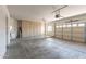 A spacious garage with built-in storage cabinets and an automatic garage door at 3765 E Oxford Ln, Gilbert, AZ 85295