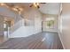Bright, open-concept space with wood-look floors and a staircase at 3765 E Oxford Ln, Gilbert, AZ 85295