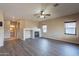 Open living room with a fireplace and views into other rooms at 3765 E Oxford Ln, Gilbert, AZ 85295