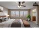 Virtually staged bedroom with wood-look floors, neutral paint, and a ceiling fan at 3765 E Oxford Ln, Gilbert, AZ 85295