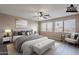 Virtually staged main bedroom boasting neutral tones, wood-look floors, and bright natural light at 3765 E Oxford Ln, Gilbert, AZ 85295