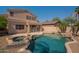 Inviting backyard oasis featuring a sparkling pool, spa, and rock features, perfect for relaxation and outdoor entertainment at 3765 E Oxford Ln, Gilbert, AZ 85295