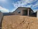 Spacious backyard featuring a covered patio, block wall, and plenty of potential for landscaping at 4226 W Lisa Ln, San Tan Valley, AZ 85144