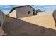 Large, blank-slate backyard, perfect for customization, enclosed by a sturdy block fence at 4226 W Lisa Ln, San Tan Valley, AZ 85144