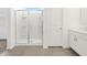 Bright bathroom features a walk-in shower with new fixtures, a glass door, and an adjacent vanity at 4226 W Lisa Ln, San Tan Valley, AZ 85144