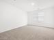 Bright bedroom showcasing a neutral-toned carpet and a window at 4226 W Lisa Ln, San Tan Valley, AZ 85144
