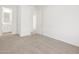 Spacious bedroom with plush carpeting and two entryways at 4226 W Lisa Ln, San Tan Valley, AZ 85144