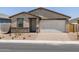 Inviting single-story home with a brick driveway, two-car garage, and desert landscaping at 4226 W Lisa Ln, San Tan Valley, AZ 85144