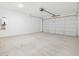 Clean, spacious two-car garage with concrete flooring at 4226 W Lisa Ln, San Tan Valley, AZ 85144