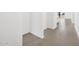 Bright hallway features neutral tile flooring and leads to the rest of the home at 4226 W Lisa Ln, San Tan Valley, AZ 85144