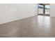 Living area with neutral tile, large sliding glass doors, and bright natural light at 4226 W Lisa Ln, San Tan Valley, AZ 85144