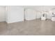 Open-concept living room with tile flooring leading into a modern kitchen at 4226 W Lisa Ln, San Tan Valley, AZ 85144