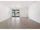 Spacious living room with tile flooring and sliding glass doors to the backyard at 4226 W Lisa Ln, San Tan Valley, AZ 85144