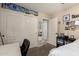 Bedroom showcasing closet space, open door to hall, and themed decor at 43121 W Sunland Dr, Maricopa, AZ 85138