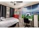 Bright bedroom with decor featuring a soccer-themed mural, sporty accents, and lots of light at 43121 W Sunland Dr, Maricopa, AZ 85138