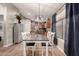 Open dining area with a table and chairs adjacent to the modern kitchen at 43121 W Sunland Dr, Maricopa, AZ 85138